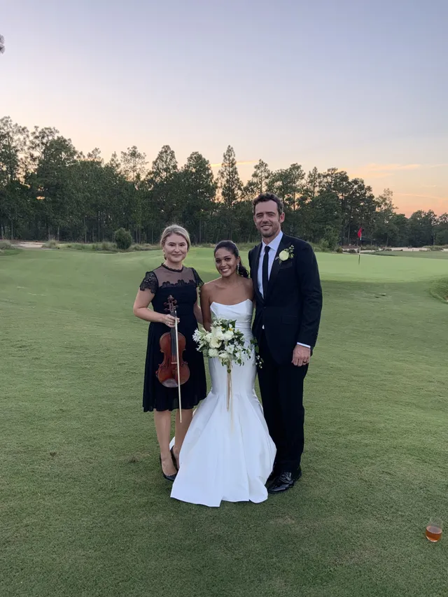 Sunset trio at golf course with pink and orange sky, elegant corporate event setting